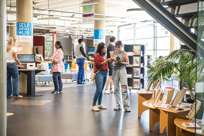 International Students at Library 1 Column 705x470px